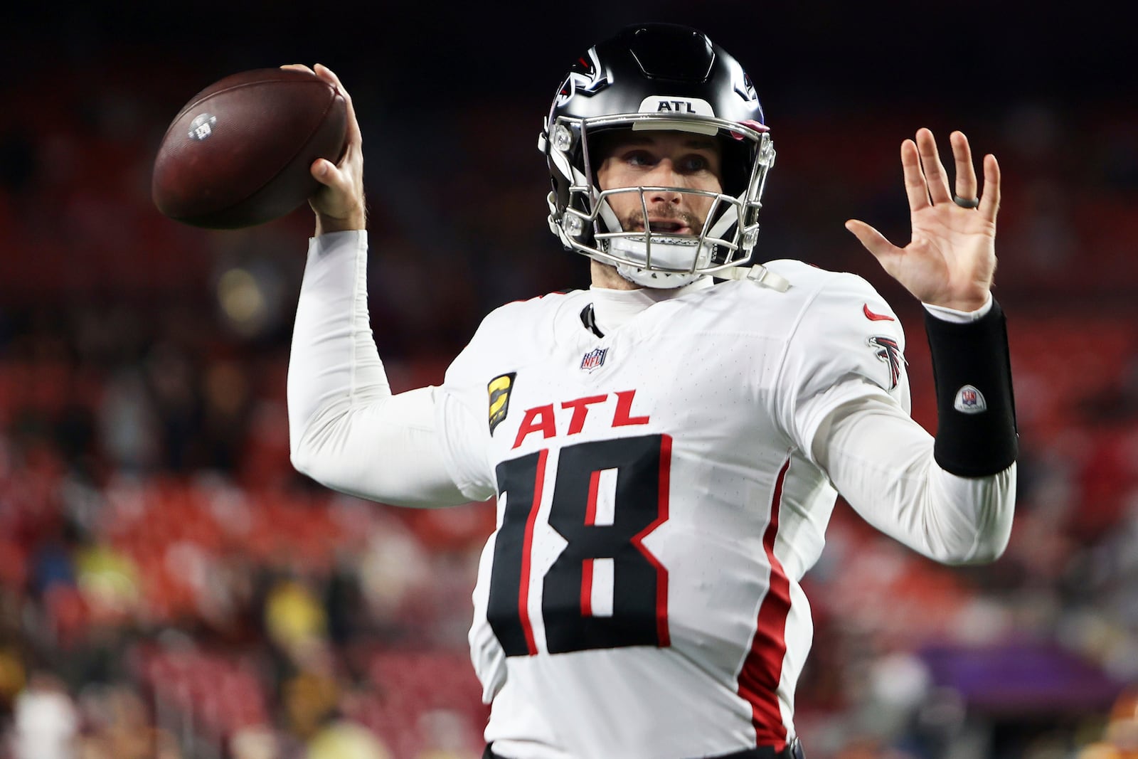 Atlanta Falcons quarterback Kirk Cousins (18) throws the ball before an NFL football game against the Washington Commanders, Sunday, Dec. 29, 2024 in Landover, Md. (AP Photo/Daniel Kucin Jr.)