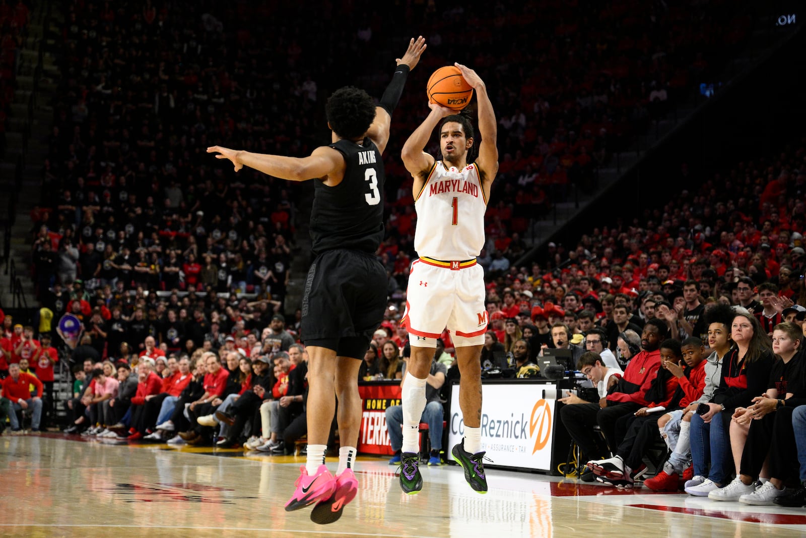 Maryland guard Rodney Rice (1) shoots against Michigan State guard Jaden Akins (3) during the second half of an NCAA college basketball game, Wednesday, Feb. 26, 2025, in College Park, Md. (AP Photo/Nick Wass)