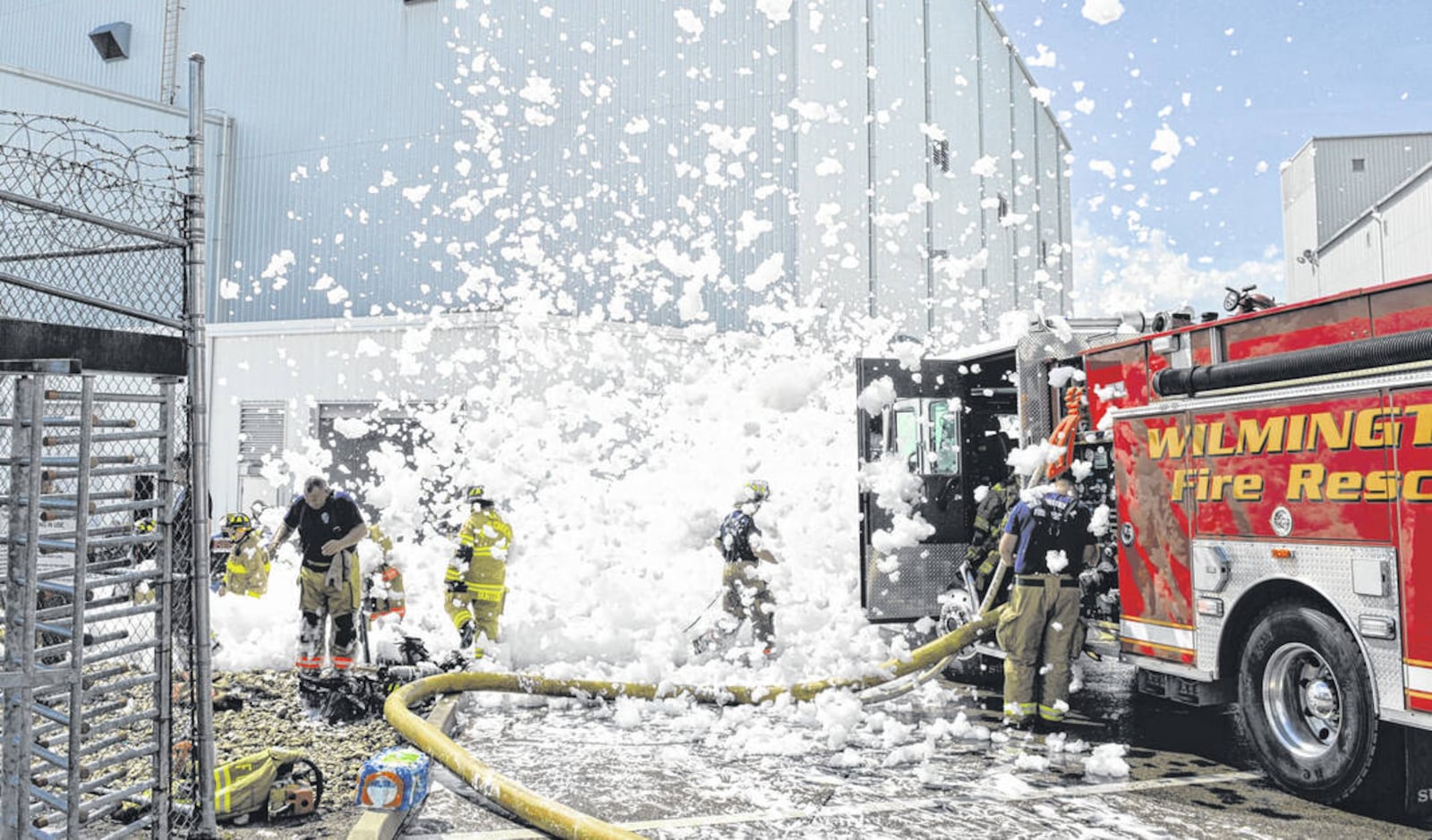 Fire suppression foam is blown out of a hangar at the Wilmington Air Park on Sunday, Aug, 7, 2022. The foam filled the hangar where one person died. TOM BARR/WILMINGTON NEWS JOURNAL