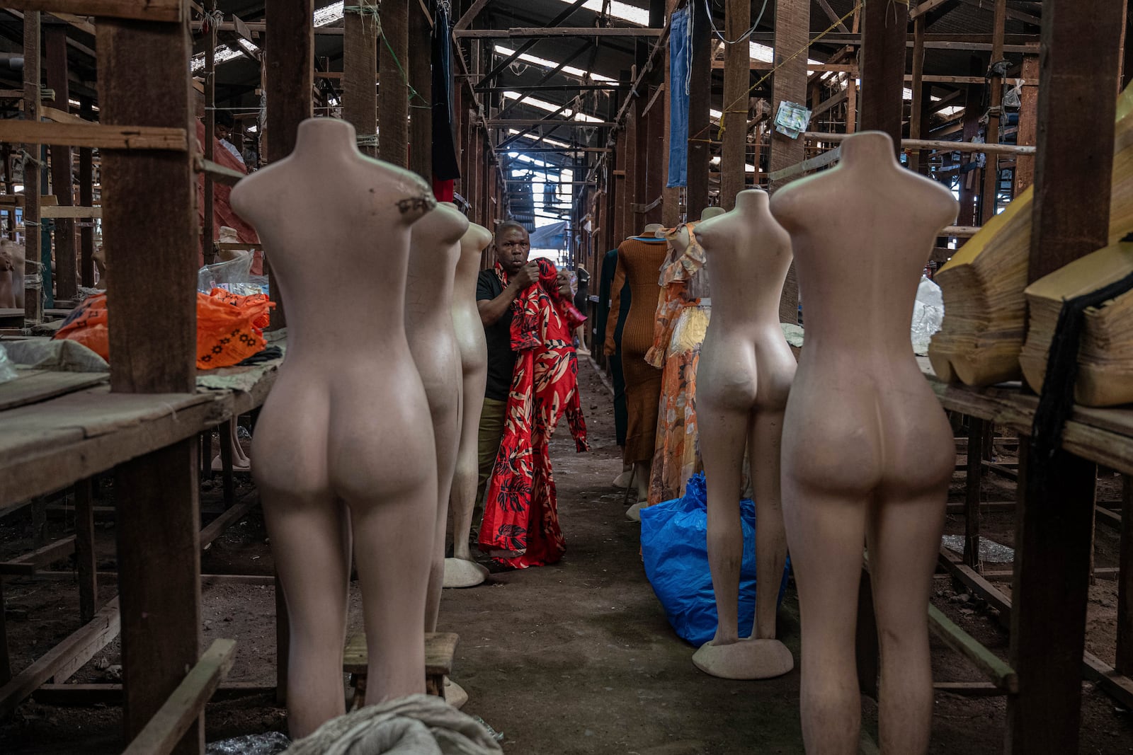 Merchants wait for customers at the Virunga market in Goma, Democratic Republic of Congo, Thursday, Feb. 27, 2025, one month after Rwanda-backed M23 rebels captured the city. (AP Photo/Moses Sawasawa)