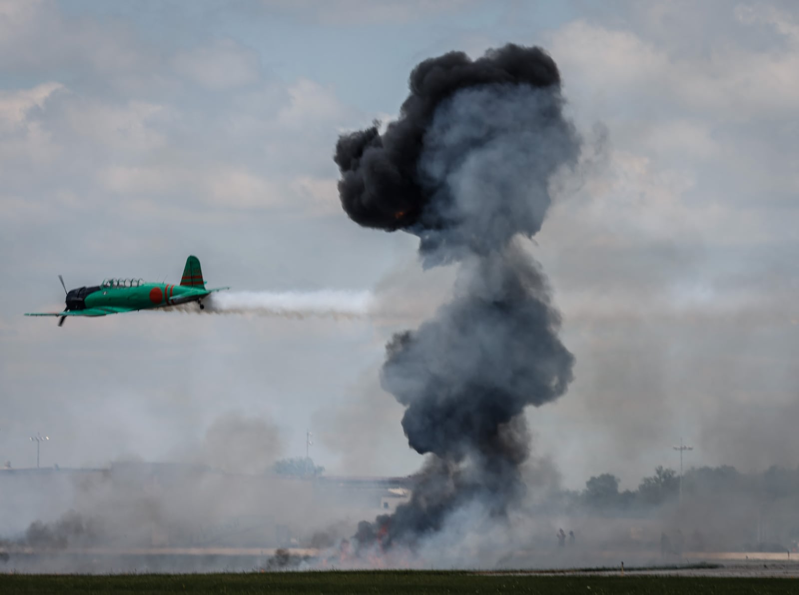 Tora! Tora! Tora! performs a recreation of the attack on Pear Harbor at the Dayton Air Show. Jim Noelker/Staff