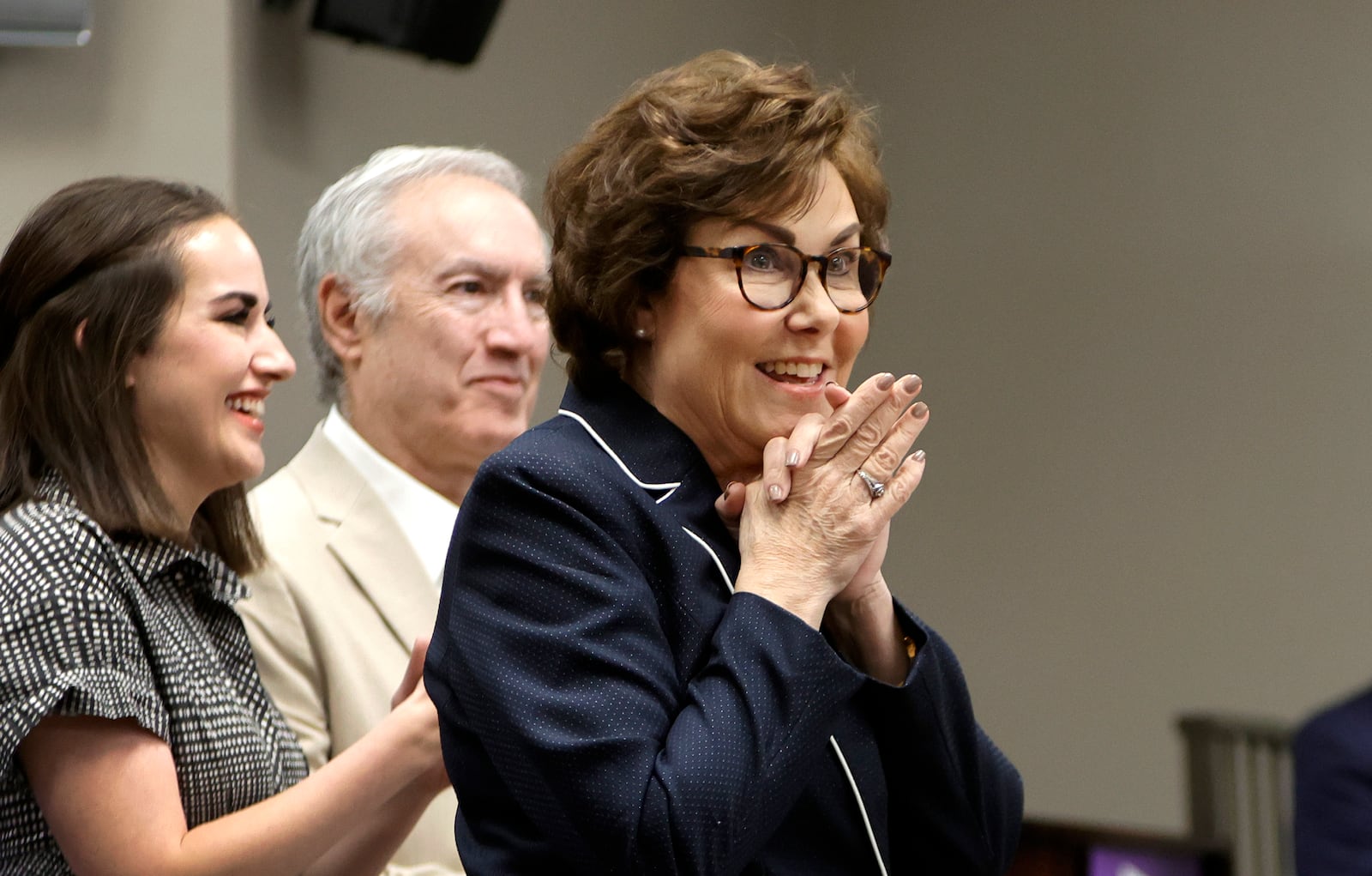 Sen. Jacky Rosen, left, D-Nev., gives a victory speech at the Teamsters Local 631 meeting hall Saturday, Nov. 9, 2024, in Las Vegas. Listening at left are her daughter Miranda Rosen and husband Larry Rosen. (Steve Marcus/Las Vegas Sun via AP)