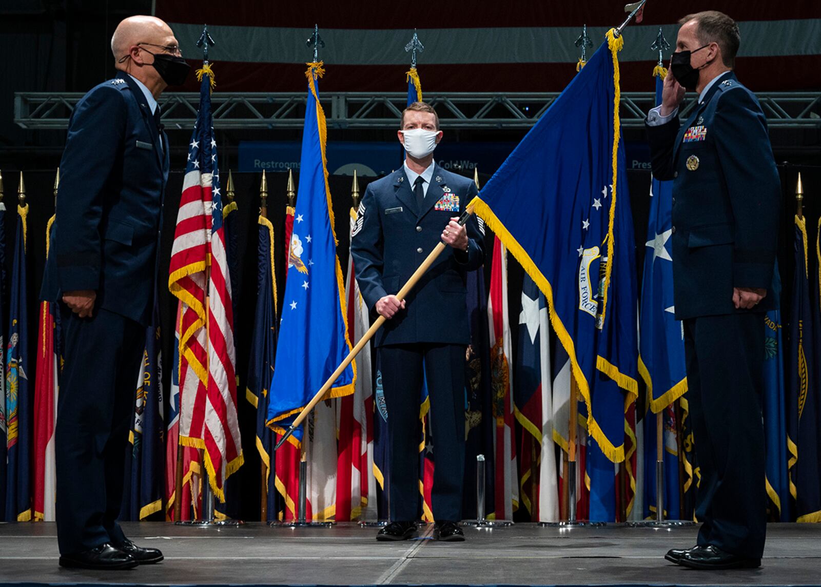 Lt. Gen. Shaun Q. Morris (right) assumes command of the Air Force Life Cycle Management Center during a change of command ceremony at the National Museum of the United States Air Force, Wright-Patterson Air Force Base Sept. 3. Gen. Arnold W. Bunch Jr., Air Force Materiel Command commander (left), presided over ceremony. Lt. Gen. Robert D. McMurry (not pictured) relinquished command of the center. The center’s command chief, Chief Master Sgt. Troie Croft (center) bore the guidon for the ceremony. (U.S. Air Force photo/Jim Varhegyi)