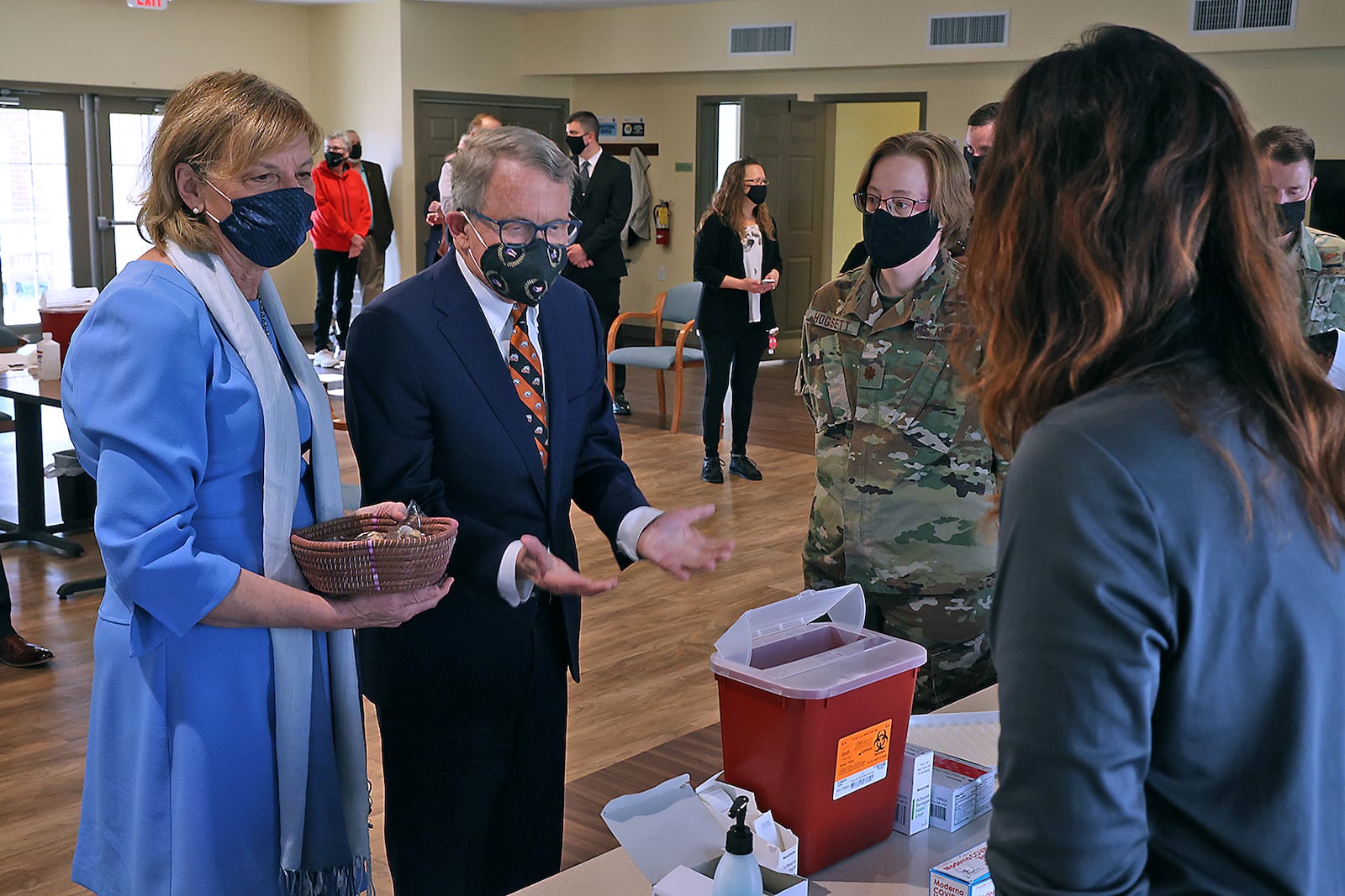 Ohio Governor Mike DeWine and his wife, Fran, talk to the nurses from the Clark County Combined Health District who were filling the COVID vaccination syringes during a visit Friday to New Carlisle Senior Living. BILL LACKEY/STAFF