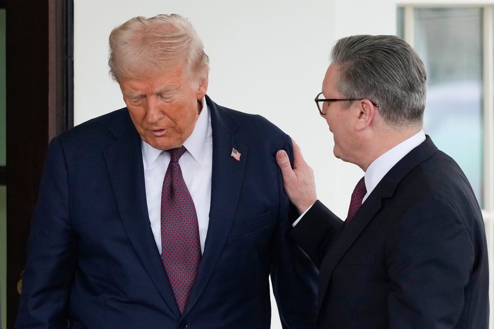 Britain's Prime Minister Keir Starmer, right, is greeted by President Donald Trump as he arrives at the White House in Washington, Thursday, Feb. 27, 2025. (AP Photo/Ben Curtis)