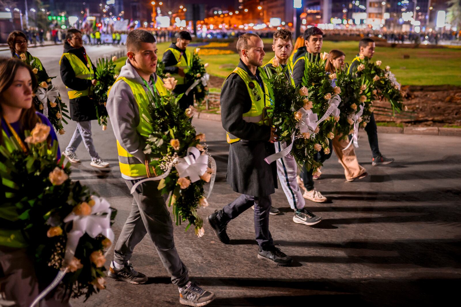 Youngsters carry wreaths with the names of victims during a protest over the collapse of a concrete canopy that killed 15 people more than two months ago, in Novi Sad, Serbia, Friday, Jan. 31, 2025. (AP Photo/Armin Durgut)