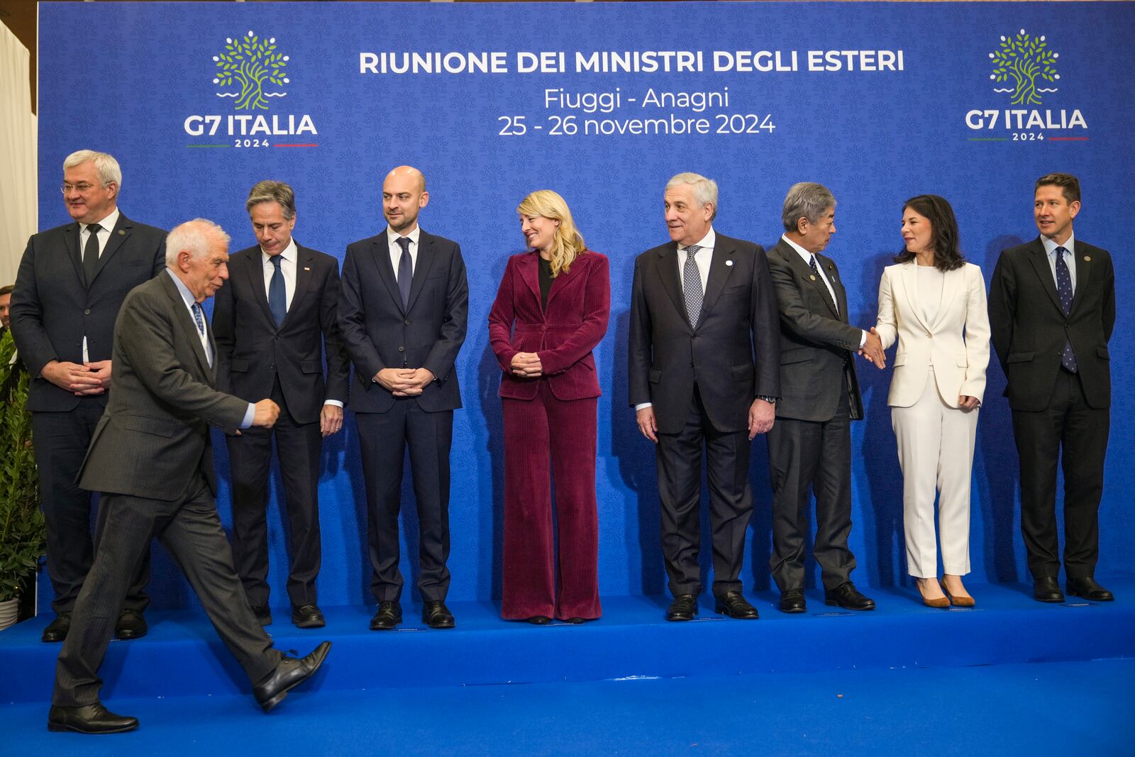 European Union foreign policy chief Josep Borrell, front, arrives to pose for a family photo with, from left, Ukrainian Foreign Minister Andrii Sybiha, U.S. Secretary of State Antony Blinken, French Foreign Minister Jean-Noël Barrot, Canada's Foreign Minister Melanie Joly, Italian Foreign Minister Antonio Tajani, Japanese Foreign Minister Takeshi Iwaya, German Foreign Minister Annalena Baerbock, Britain's Foreign Office Political Director Christian Turner at the G7 of foreign Ministers in Fiuggi, some 70 kilometers south-east of Rome, Tuesday, Nov. 26, 2024. (AP Photo/Alessandra Tarantino, Pool)