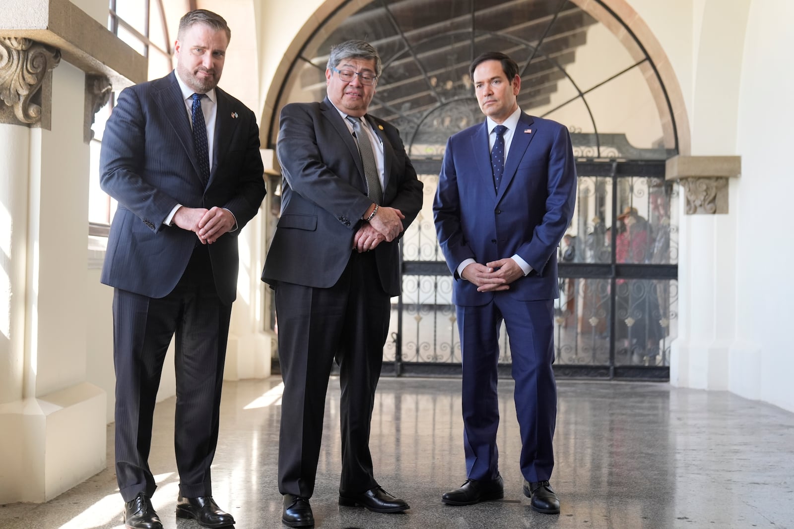 U.S. Ambassador Tobin Bradley, from left, Guatemalan Interior Minister Francisco Jiménez, and U.S. Secretary of State Marco Rubio, watch a simulation of a sniffer dog trained to find narcotics, at La Aurora International Airport in Guatemala City, Wednesday, Feb. 5, 2025. (AP Photo/Mark Schiefelbein, Pool)