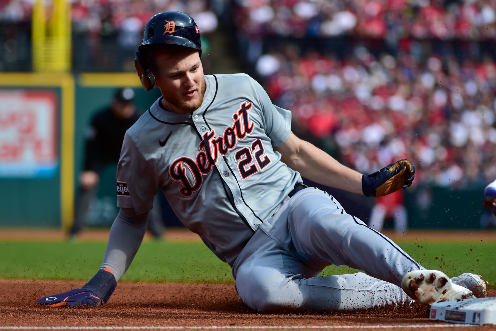 Detroit Tigers' Parker Meadows (22) steals third base during the second inning in Game 5 of baseball's American League Division Series against the Cleveland Guardians, Saturday, Oct. 12, 2024, in Cleveland. (AP Photo/Phil Long)