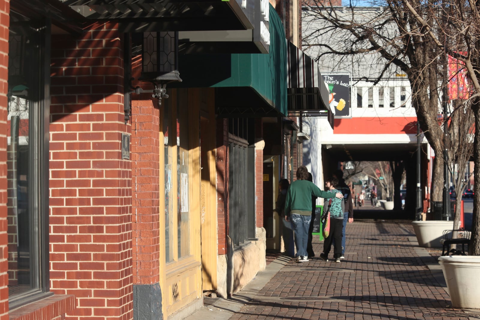 A group of young people enters a shop near the Oldtown district, Friday, Jan. 31, 2025, in downtown Wichita, Kansas. (AP Photo/John Hanna)