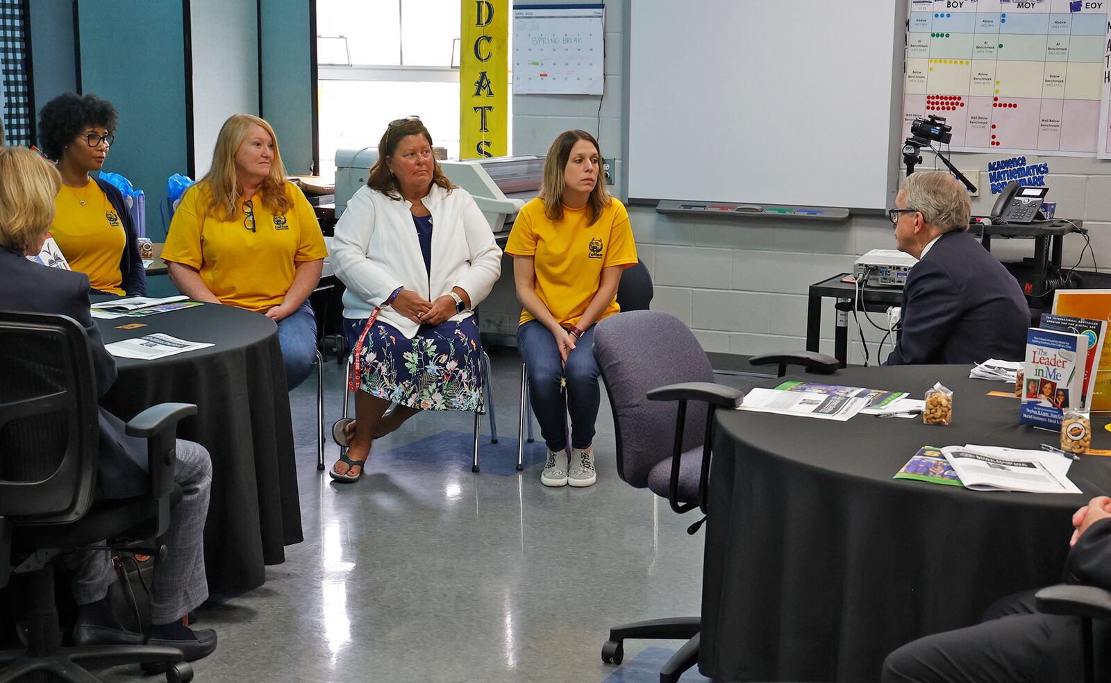 Governor Mike DeWine talks with four Fulton Elementary School teachers about the new reading curriculum Friday, April 14, 2023 as he tours the Springfield City school. The governor is touring schools across the state to learn about their new ready curriculum. BILL LACKEY/STAFF