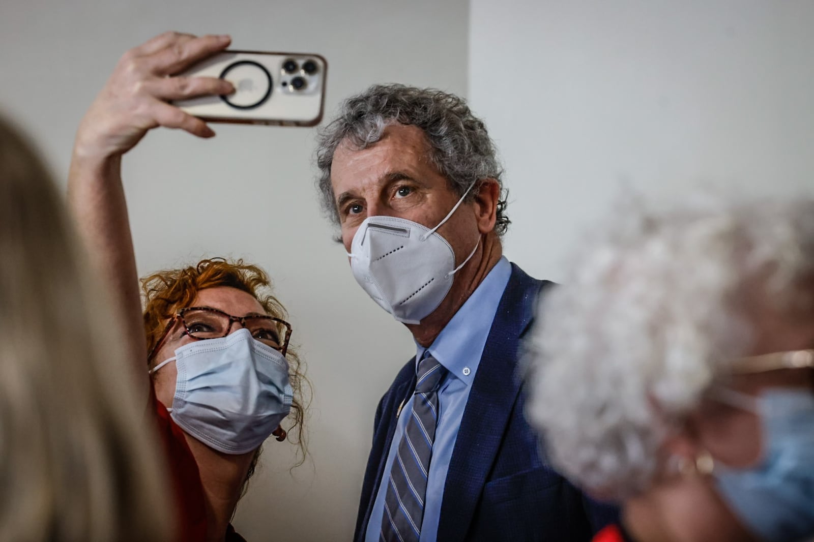 Ohio Sen. Sherrod Brown takes a selfie with Dayton VA nurse, Rhonda Risner at a press conference Tuesday April 11, 2023 at Central State West Campus in Dayton. 
Senator Brown is co-sponsoring a bill in congress called the nurse staffing standards for hospital patient safety and quality act. JIM NOELKER/STAFF