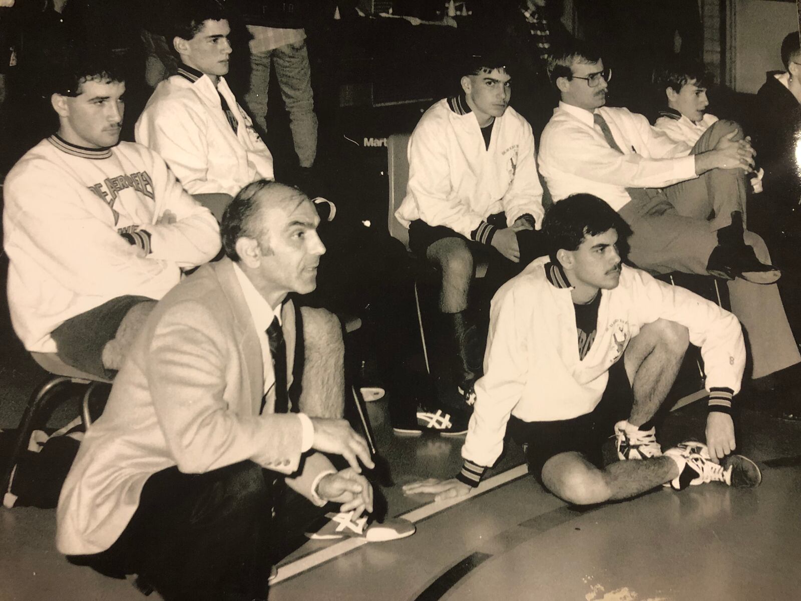 Stamat Bulugari, front left, coaches the Beavercreek High School team in 1991. At front right is his son Mike, and his son Tony is seated in the chair in the center. The current Beavercreek coach, Gary Wise, is second from right.