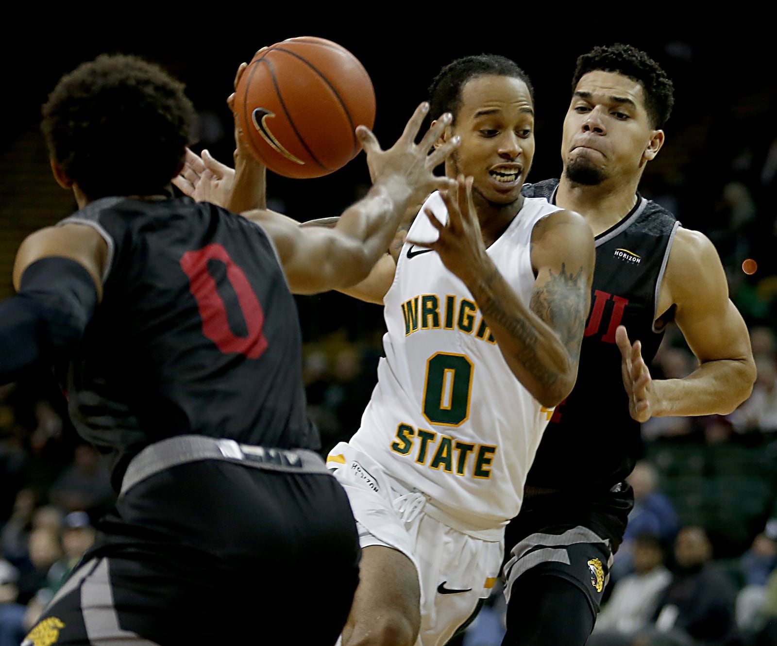 Wright State University guard Jaylon Hall cuts between IUPUI’s Jaylen Minnett (0) and Marcus Burk during a Horizon League game at the Nutter Center in Fairborn Sunday, Feb. 16, 2020. Wright State won 106-66. Contributed photo by E.L. Hubbard