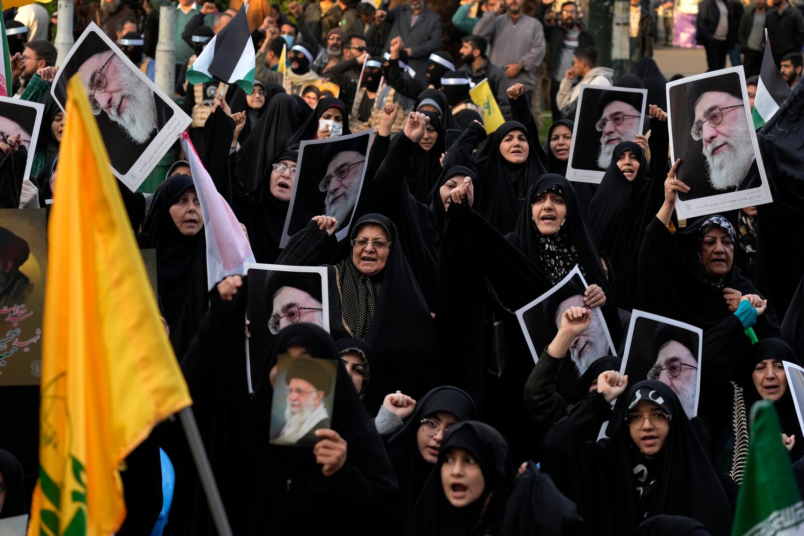 Iranian demonstrators hold posters of the Supreme Leader Ayatollah Ali Khamenei in a ceremony commemorating the late Hamas leader Yahya Sinwar and Hashem Safieddine, a powerful cleric who was expected to succeed slain Hezbollah leader Hassan Nasrallah and was killed by an Israeli airstrike in Beirut, at the Felestin (Palestine) Sq. in Tehran, Iran, Thursday, Oct. 24, 2024. (AP Photo/Vahid Salemi)