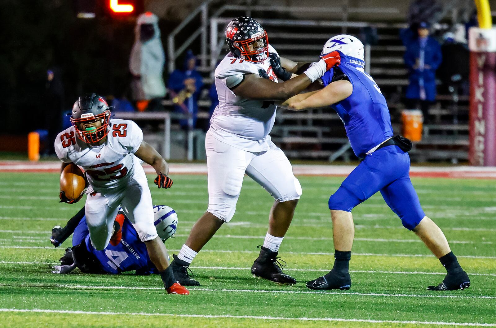 Lakota West running back Cameron Goode carries the ball after running through a hole created by lineman Tegra Tshabola during their Division I regional semifinal football playoff game against St. Xavier Friday, Nov. 12, 2021 at Princeton High School's Pat Mancuso Field. Tshabola was named first-team, All-Ohio on Thursday. NICK GRAHAM / STAFF