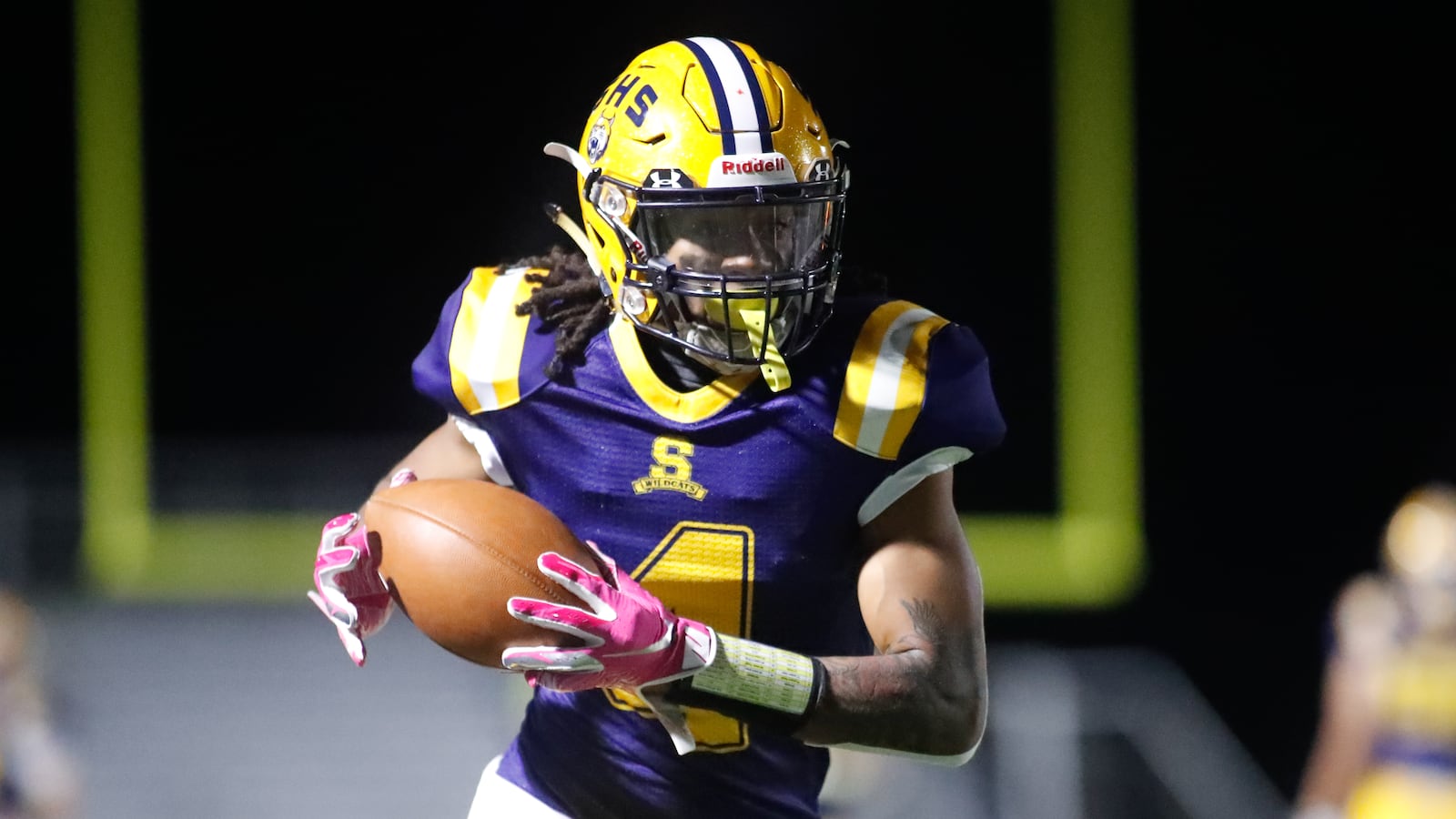 Springfield High School senior Robert Jordan gathers the ball after catching a pass during the Wildcats 27-17 victory over Toledo Whitmer in a Division I, Region 2 playoff game on Friday, Oct. 9. CONTRIBUTED PHOTO BY MICHAEL COOPER