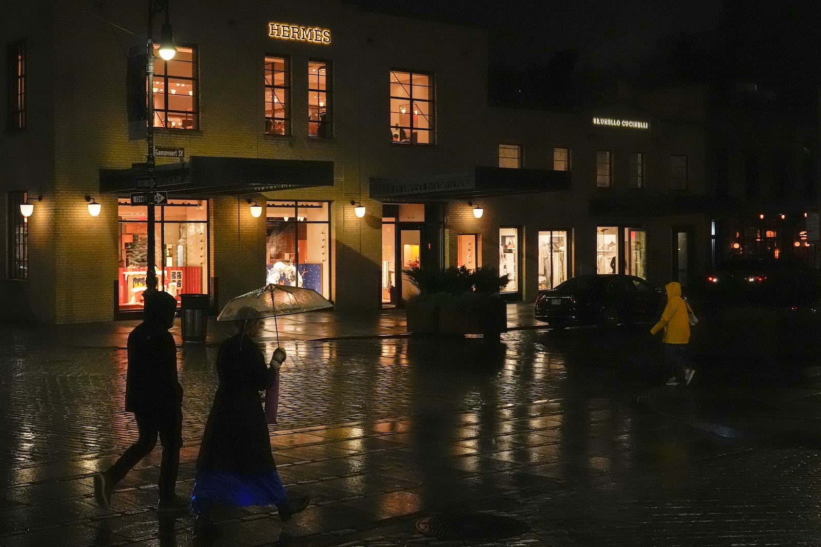 People walk past a Hermes store in the Meatpacking District of Manhattan, Friday, Nov. 22, 2024, in New York. (AP Photo/Julia Demaree Nikhinson)