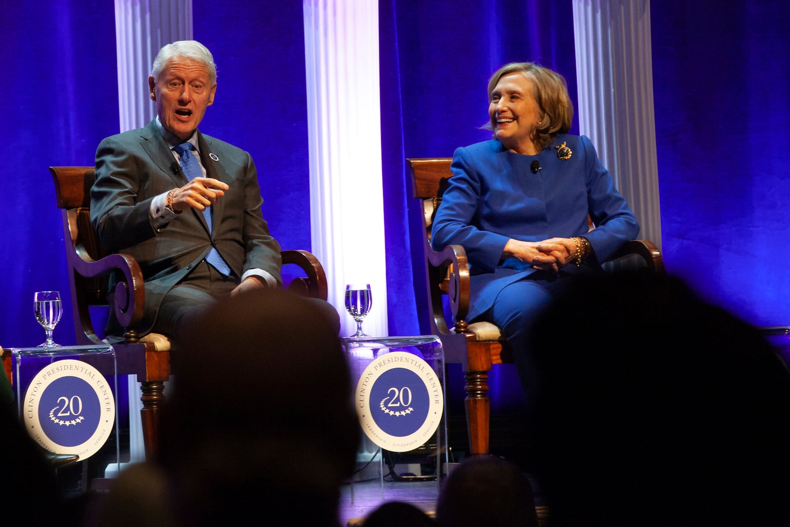 Former President Bill Clinton and former Secretary of State Hillary Rodham Clinton respond to audience questions on Saturday, Dec. 7, 2024 at the Robinson Center auditorum in Little Rock, Ark. (AP Photo/Katie Adkins)