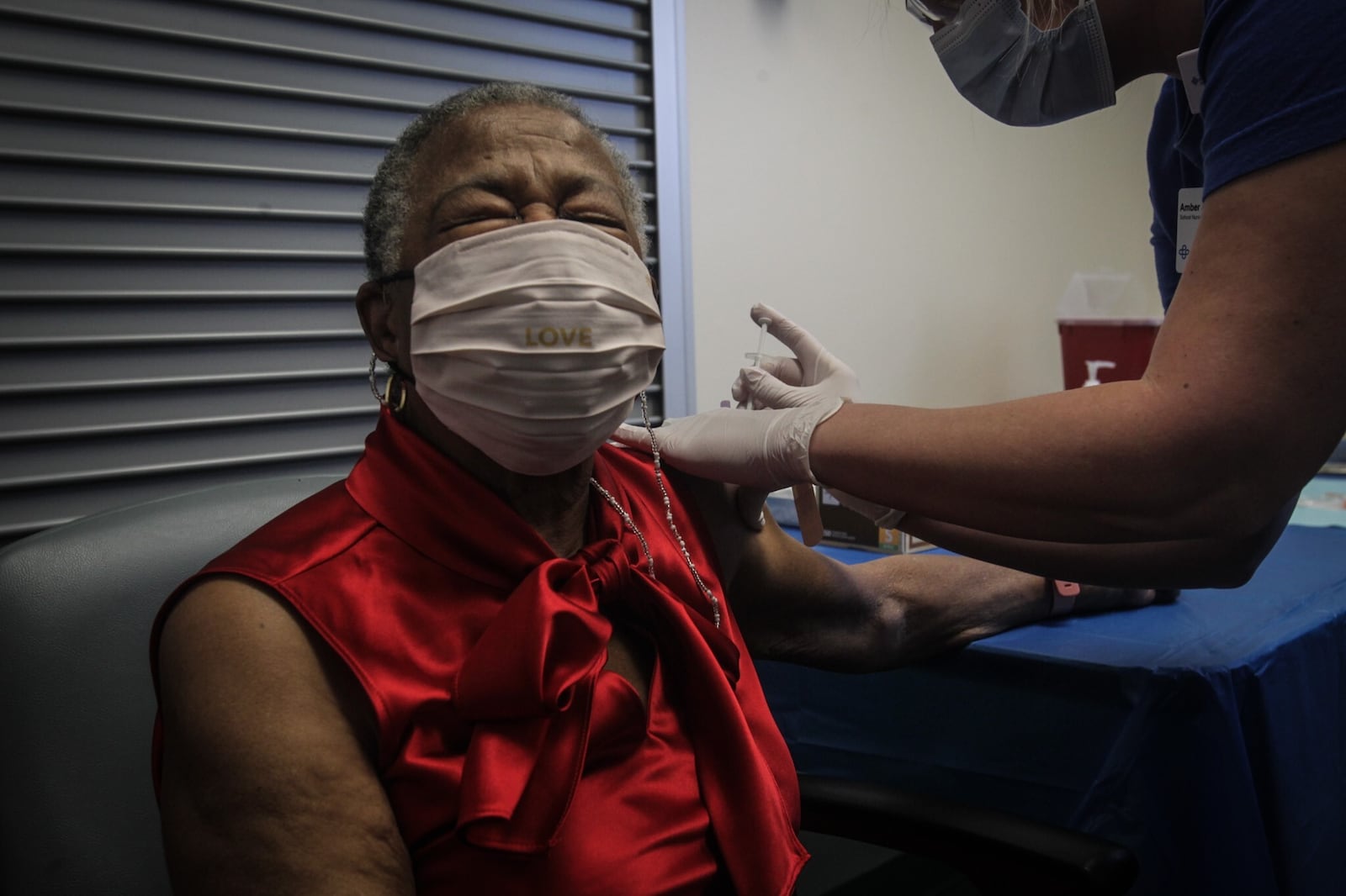 Shirley Porter receives a COVID-19 vaccine at the Premier Health Forsaker Street Clinic Tuesday morning Jan. 19, 2021. Porter said she doesn't like shots but feels good about getting the COVID-19 vaccine. JIM NOELKER/STAFF