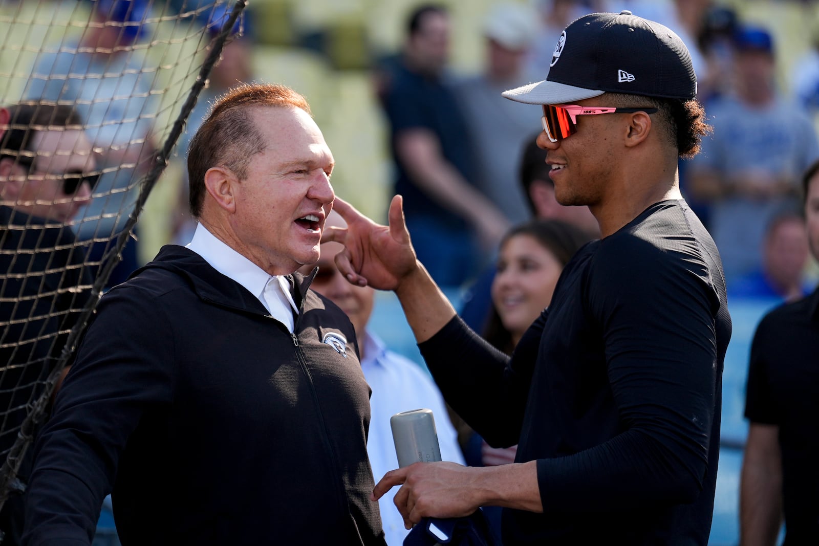 FILE - New York Yankees' Juan Soto talks with agent Scott Boras before Game 1 of the baseball World Series against the Los Angeles Dodgers, Friday, Oct. 25, 2024, in Los Angeles. (AP Photo/Julio Cortez, File)