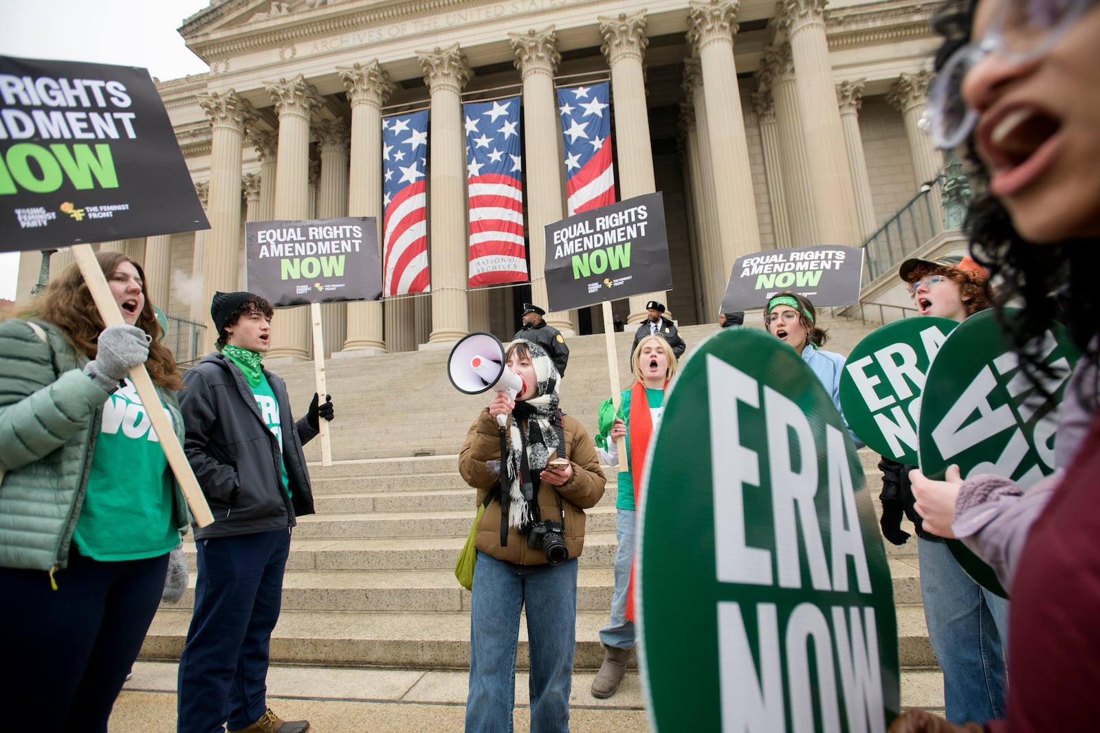 People hold a rally in front of the National Archives to highlight President Joe Biden's decision to declare the Equal Rights Amendment (ERA) as the 28th Amendment to the United States Constitution, Friday, Jan. 17, 2025, in Washington. (AP Photo/Rod Lamkey, Jr.)