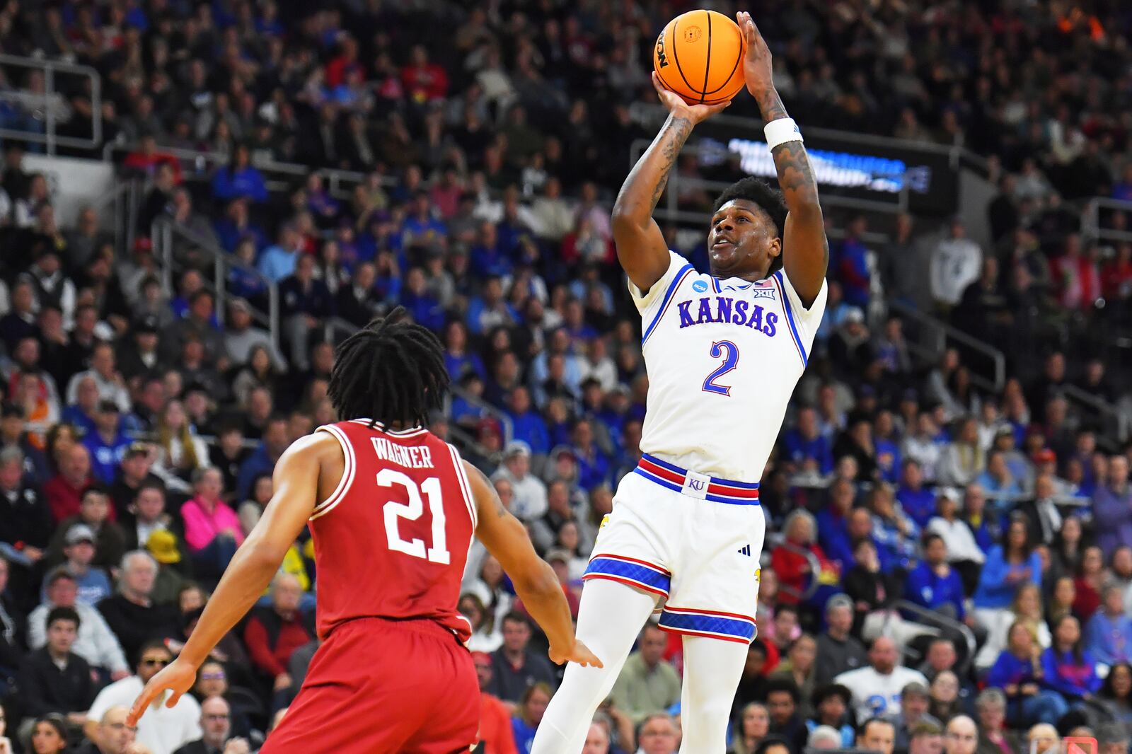 Kansas guard AJ Storr (2) takes a shot against Arkansas during the first half in the first round of the NCAA college basketball tournament, Thursday, March 20, 2025, in Providence, R.I. (AP Photo/Steven Senne)