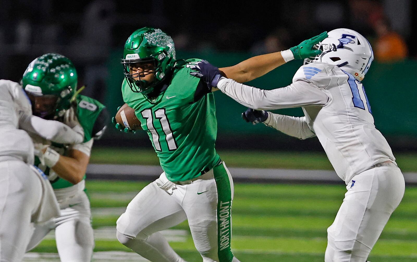 Northmont's Calilin Grant tries to avoid a tackle by Fairborn's Cayden Osbourne Friday, Oct. 27, 2023. BIILL LACKEY/STAFF