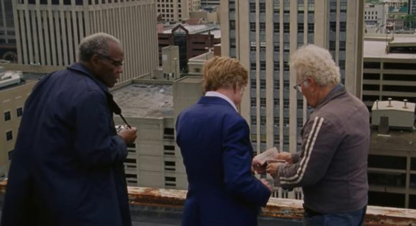 Danny Glover (from left), Robert Redford and Tom Waits in a scene from “The Old Man & the Gun” that was filmed in downtown Dayton. CONTRIBUTED