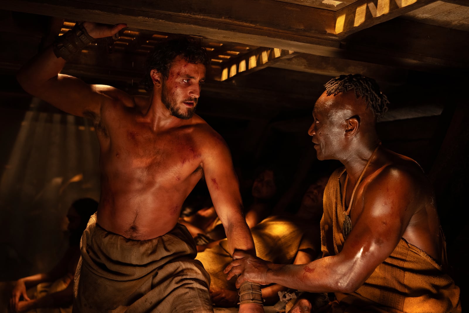 This image released by Paramount Pictures shows Paul Mescal, left, and Peter Mensah in a scene from "Gladiator II." (Aidan Monaghan/Paramount Pictures via AP)