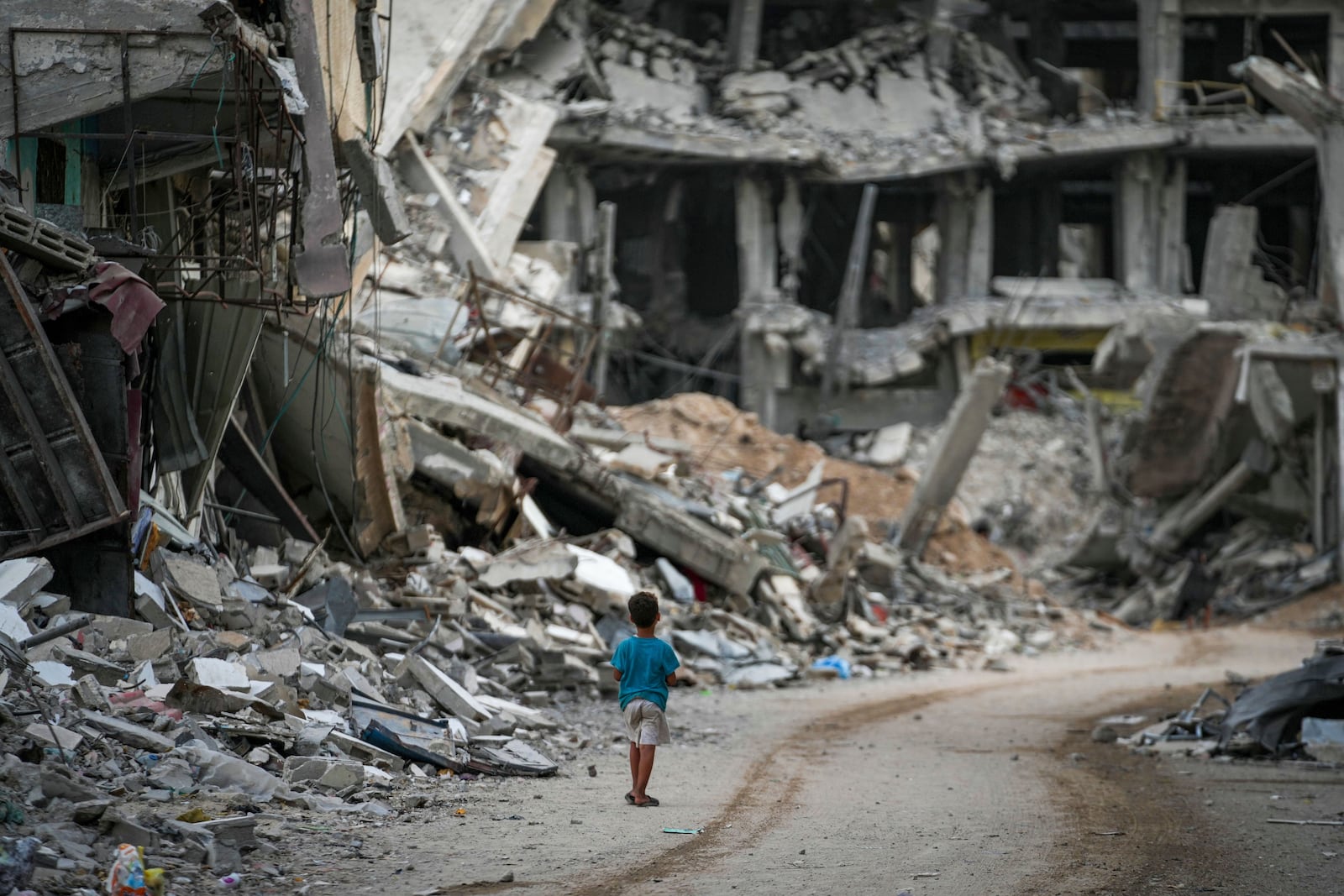 FILE - A child walks through destruction in Khan Younis, Gaza Strip on Sept. 12, 2024. (AP Photo/Abdel Kareem Hana, File)