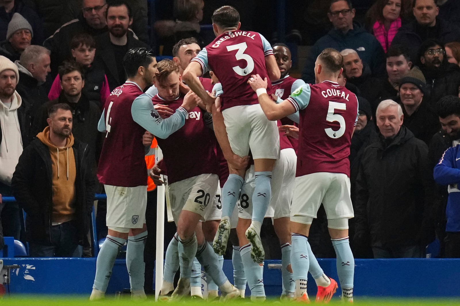 West Ham's Jarrod Bowen (20) celebrates with team mates after scoring his side's opening goal during the English Premier League soccer match between Chelsea and West Ham United at Stamford Bridge stadium in London, Monday, Feb. 3, 2025. (AP Photo/Kirsty Wigglesworth)