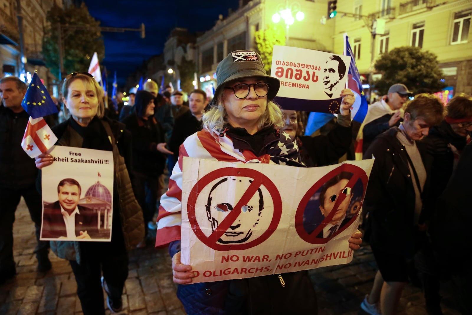 Protesters take part in a rally against alleged violations in a recent parliamentary election in Tbilisi, Georgia, Monday, Nov. 4, 2024. (AP Photo/Zurab Tsertsvadze)