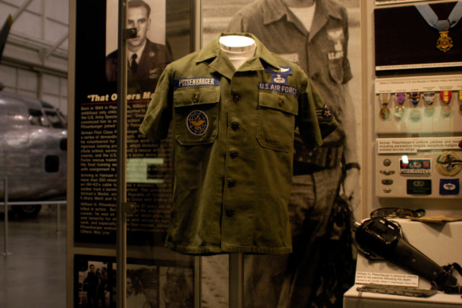 Part of A1C William H. Pitsenbarger’s uniform on display in the Modern Flight Gallery at the National Museum of the U.S. Air Force. (U.S. Air Force photo)