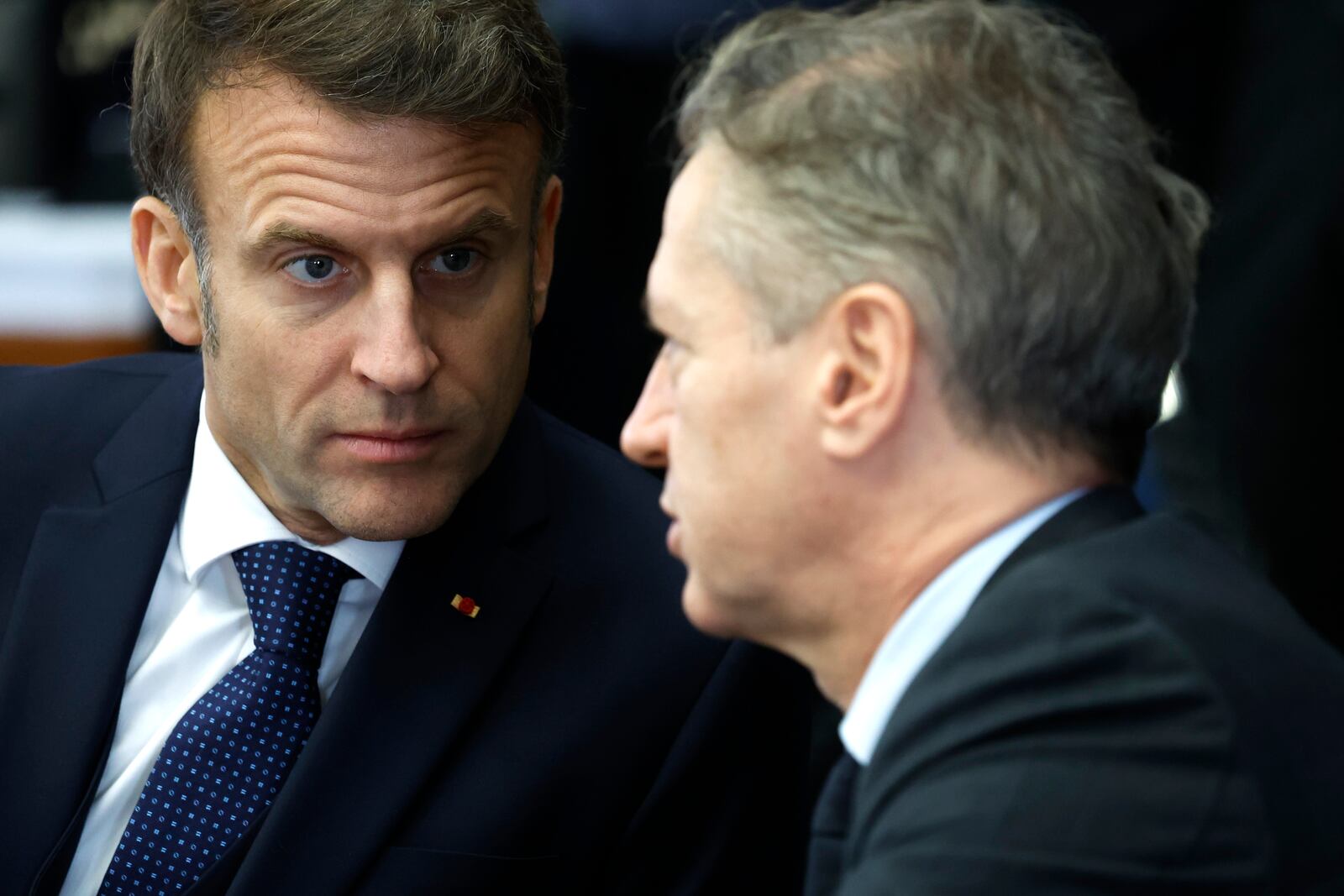 French President Emmanuel Macron, left, speaks with Slovenia's Prime Minister Robert Golob at a round table meeting during an EU summit in Brussels, Monday, Feb. 3, 2025. (AP Photo/Geert Vanden Wijngaert)