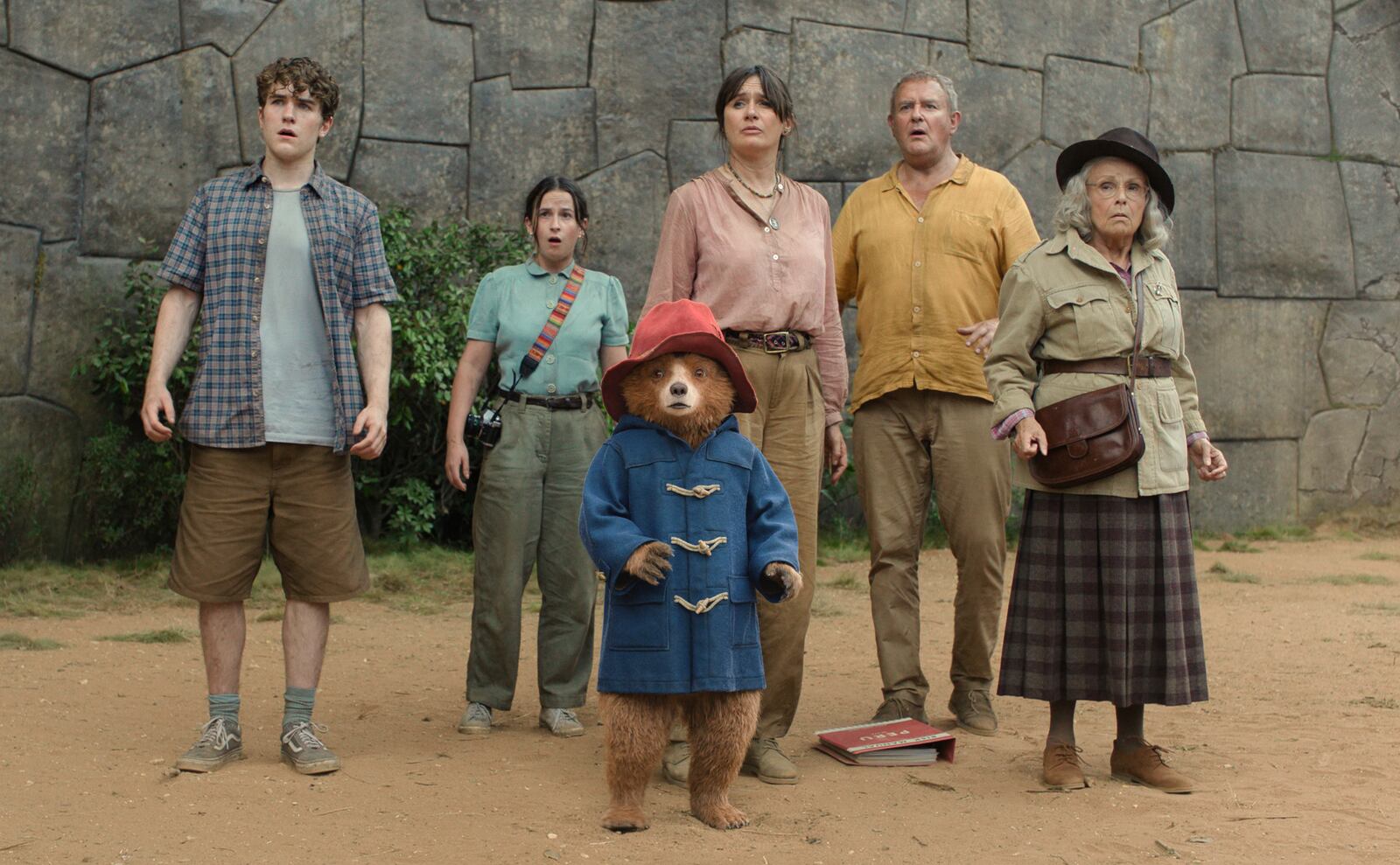 This image released by Sony Pictures shows, from left, Samuel Joslin, Madeleine Harris, Paddington, voiced by Ben Whishaw, Emily Mortimer, Hugh Bonneville, and Julie Walter in a scene from "Paddington in Peru." (Sony Pictures via AP)