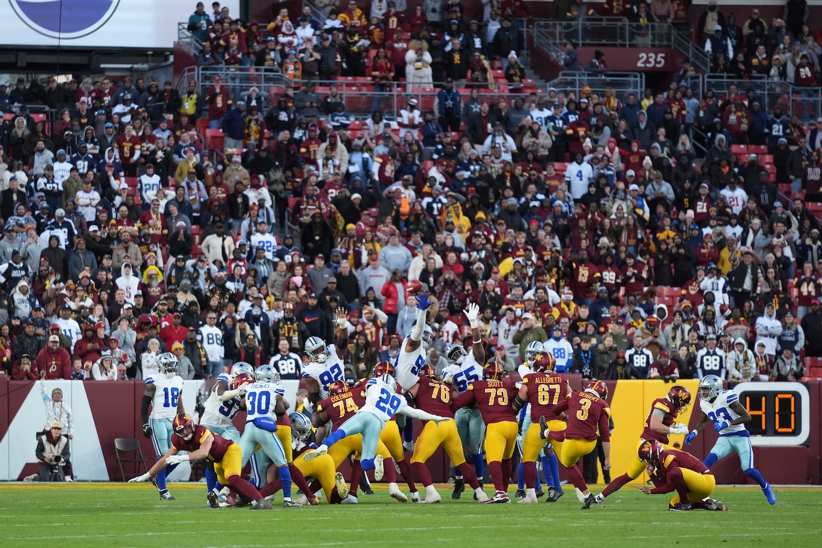 Washington Commanders place kicker Austin Seibert (3) kicks an unsuccessful point after attempt during the second half of an NFL football game against the Dallas Cowboys, Sunday, Nov. 24, 2024, in Landover, Md. (AP Photo/Stephanie Scarbrough)