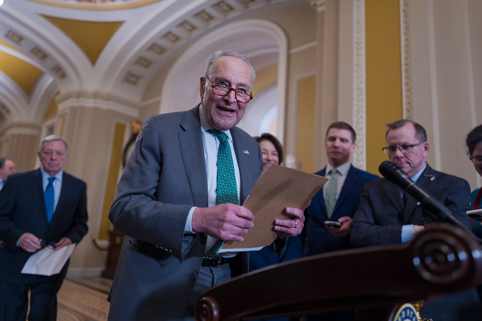 Senate Minority Leader Chuck Schumer, D-N.Y., arrives to speak with reporters as Republicans work to pass an interim spending bill that would avoid a partial government shutdown and keep federal agencies funded through September, at the Capitol in Washington, Tuesday, March 11, 2025. (AP Photo/J. Scott Applewhite)