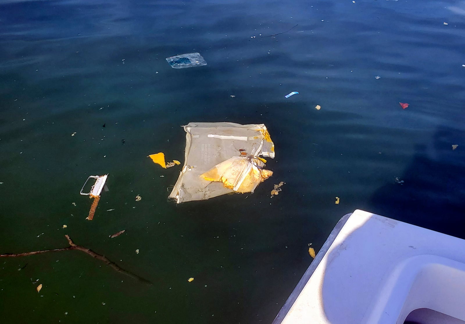 This image provided by Dean Naujoks shows debris floating in Potomac River south of Ronald Reagan Washington National Airport in Alexandria, Va., Thursday, Jan. 30, 2025. (Dean Naujoks via AP)