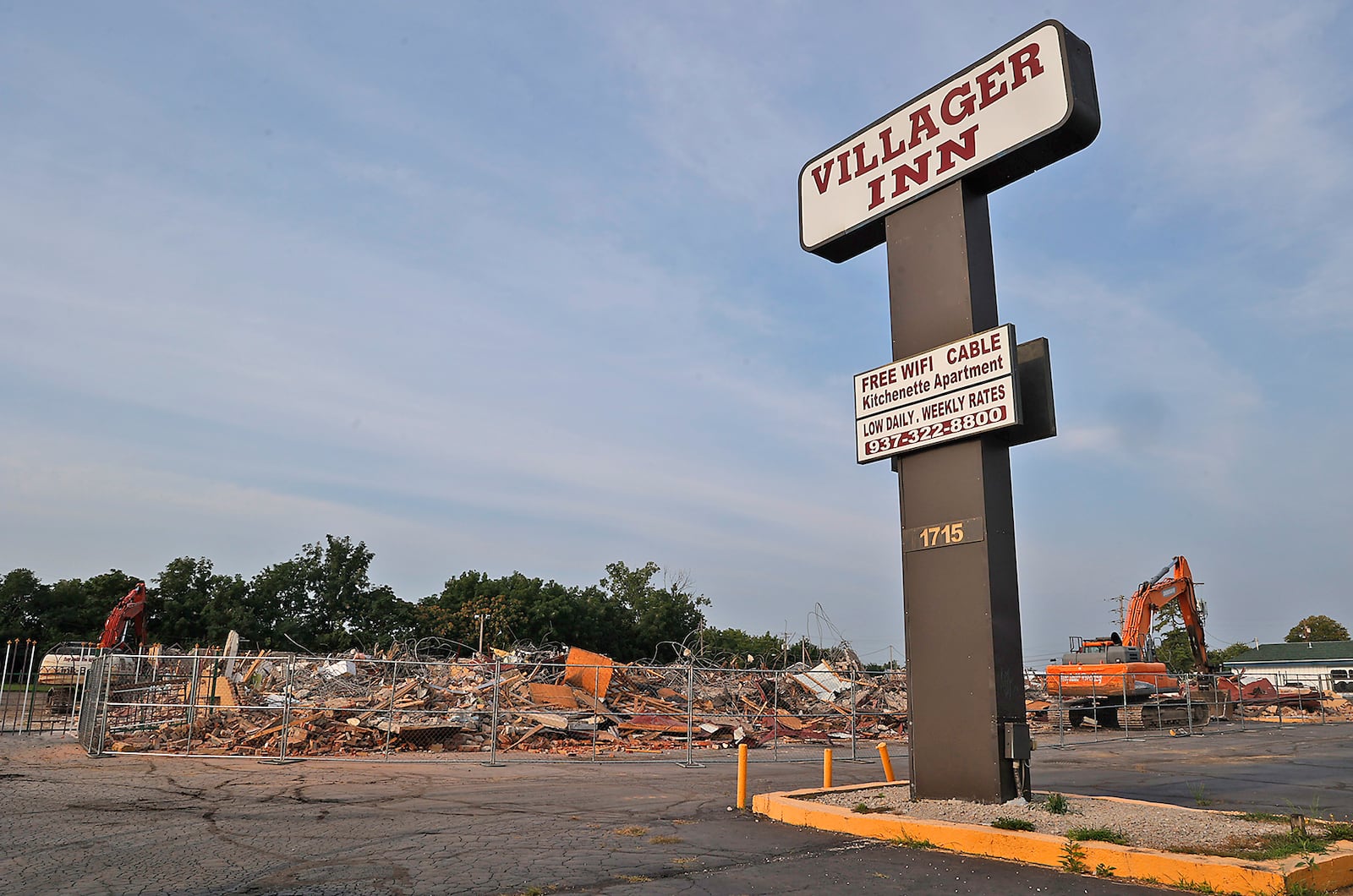 All that remains of the Villager Inn at 1715 W. North St. Monday, August 21, 2023, is the sign and a giant pile of rubble after it was demolished Saturday. BILL LACKEY/STAFF