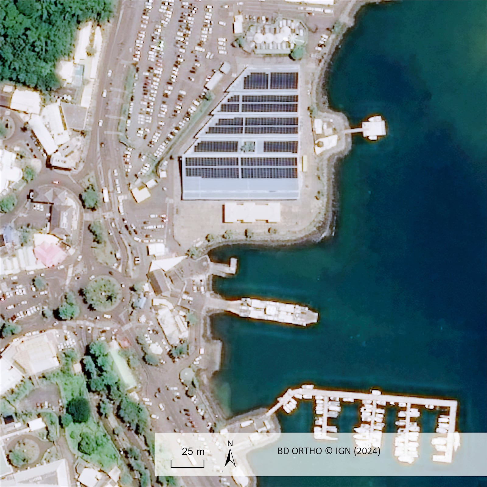 This undated satellite photo provided Wednesday Dec.18, 2024 by the Institut Geographique National (IGN) shows the port of Mamoudzou, in the Indian Ocean French territory of Mayotte, before the cyclone Chido. (IGN via AP)