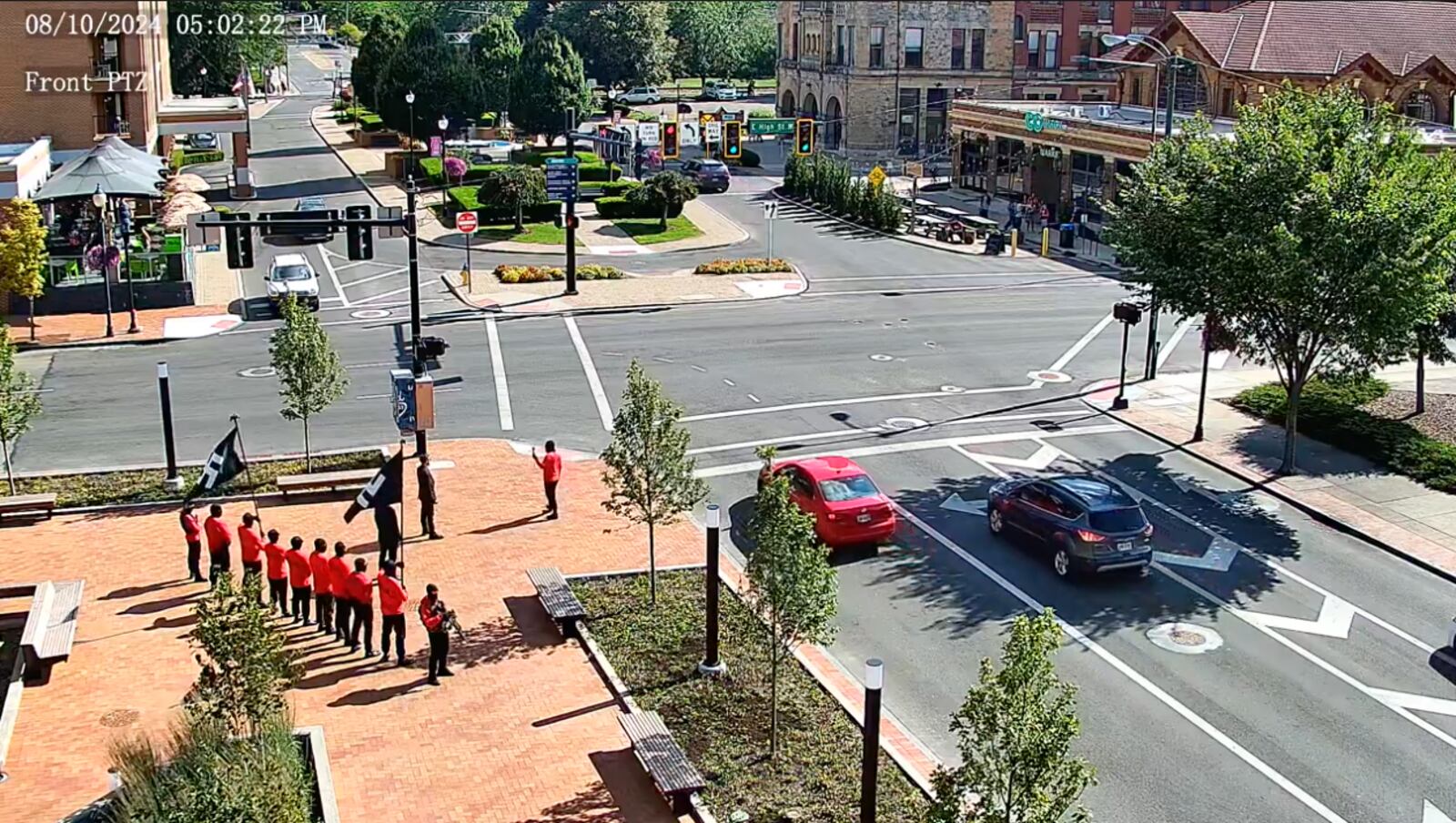 A still image taken from a city of Springfield video camera shows a group carrying Nazi flags and guns demonstrating on the Springfield City Hall plaza at 5 p.m. Aug. 10.