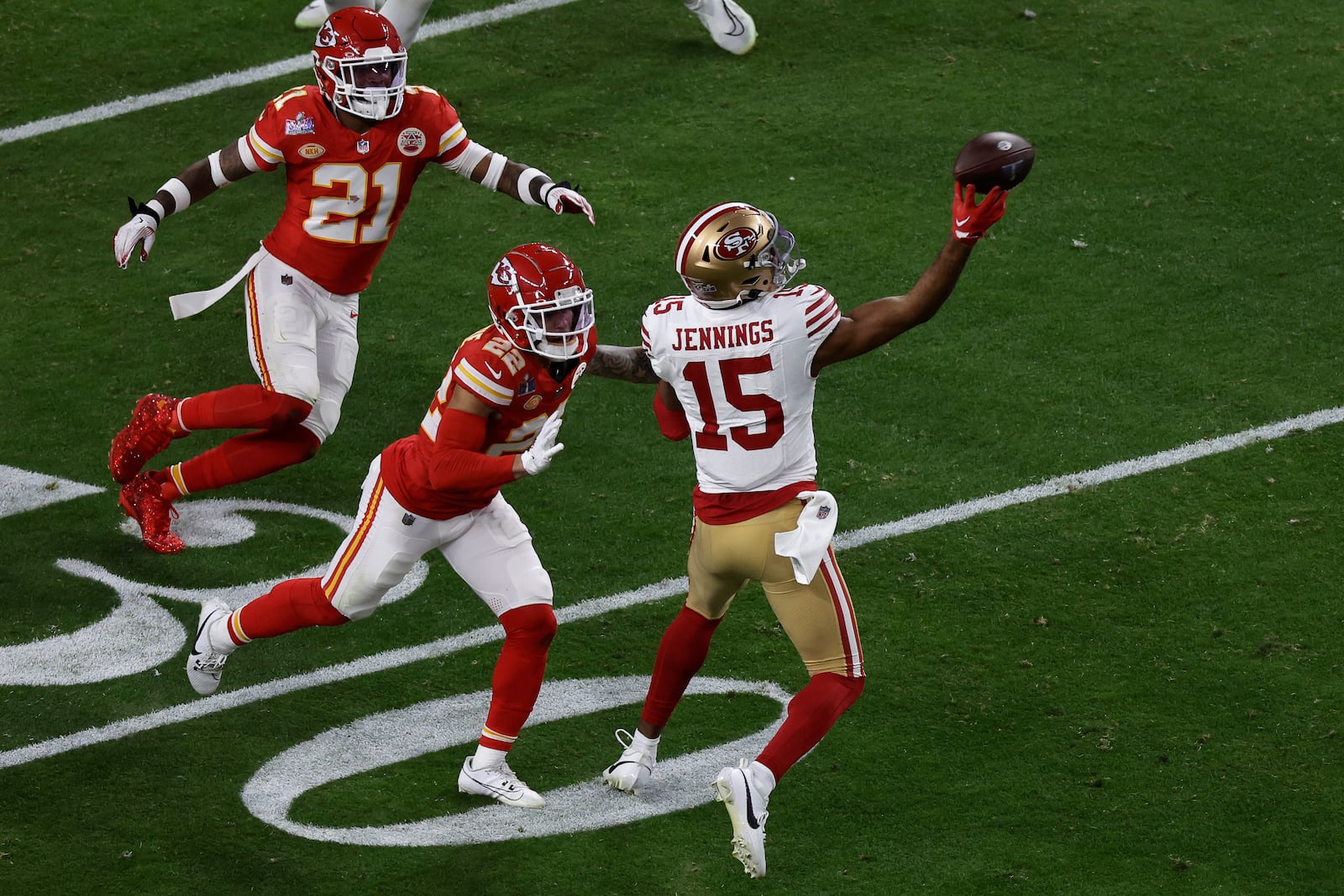 FILE - San Francisco 49ers wide receiver Jauan Jennings (15) throws a touchdown pass against the Kansas City Chiefs during the NFL Super Bowl 58 football game, Feb. 11, 2024, in Las Vegas. (AP Photo/Adam Hunger, File)