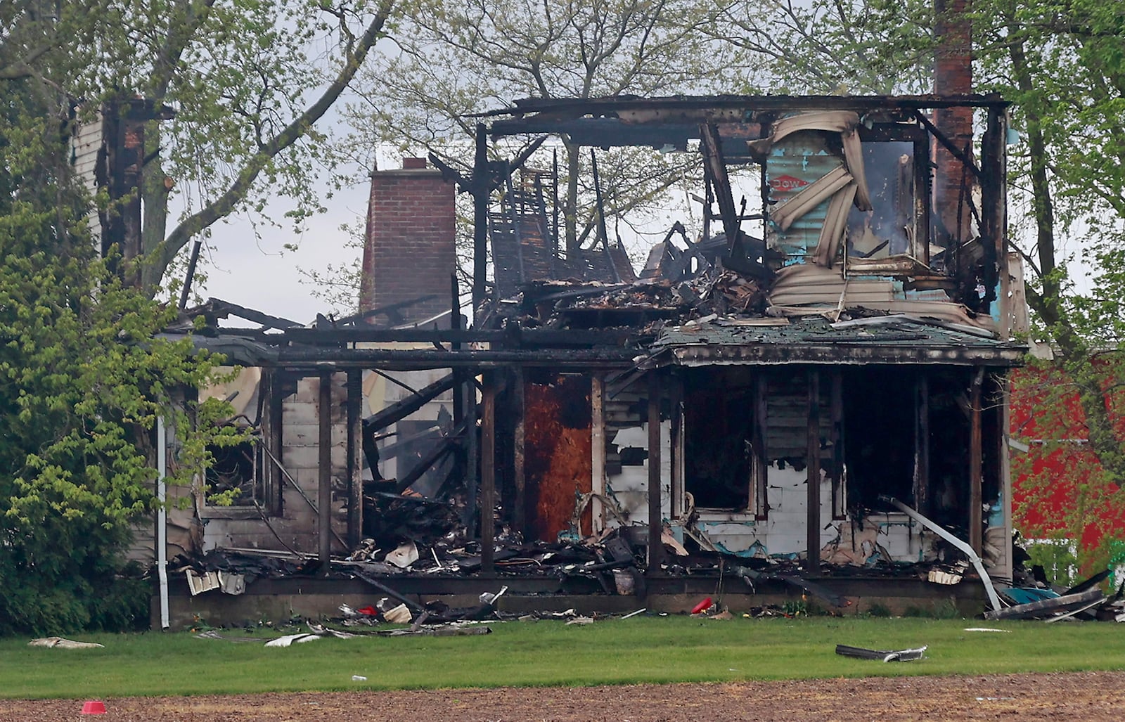 The remains of a farm house on Botkin Road in Madison Township are still smoldering Tuesday, May 2, 2023 after a fire destroyed the home Monday afternoon. Madison Township firefighters were on the scene for several hours and again in the night after it rekindled. BILL LACKEY/STAFF