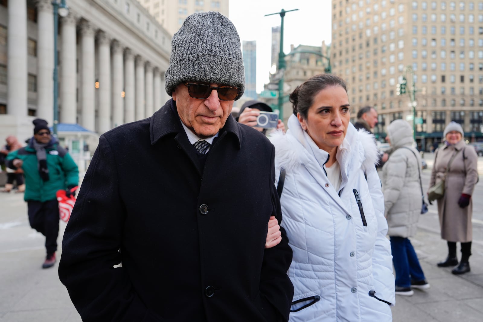 Erden Arkan, left, leaves federal court, Friday, Jan. 10, 2025, in New York after pleading guilty to a charge alleging that he worked with a Turkish government official to funnel illegal campaign contributions to New York City Mayor Eric Adams. (AP Photo/Julia Demaree Nikhinson)