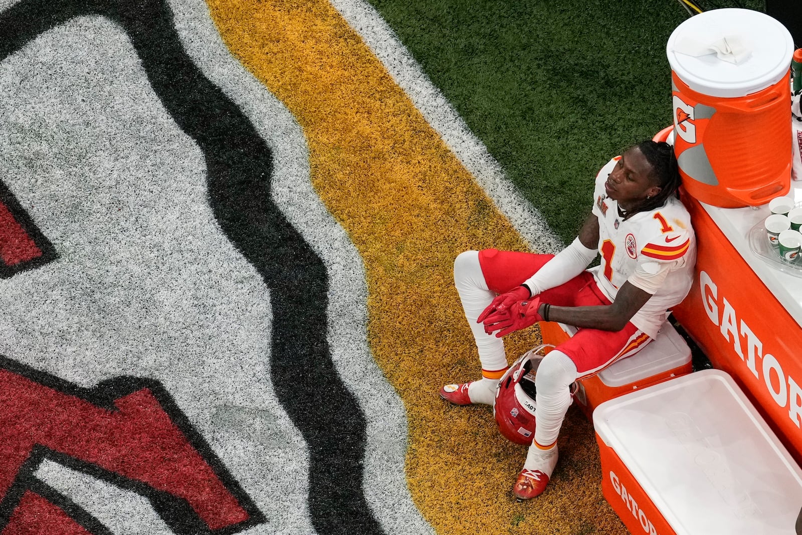 Kansas City Chiefs wide receiver Xavier Worthy (1) sits on a cooler during the second half of the NFL Super Bowl 59 football game against the Philadelphia Eagles, Sunday, Feb. 9, 2025, in New Orleans. (AP Photo/David J. Phillip)