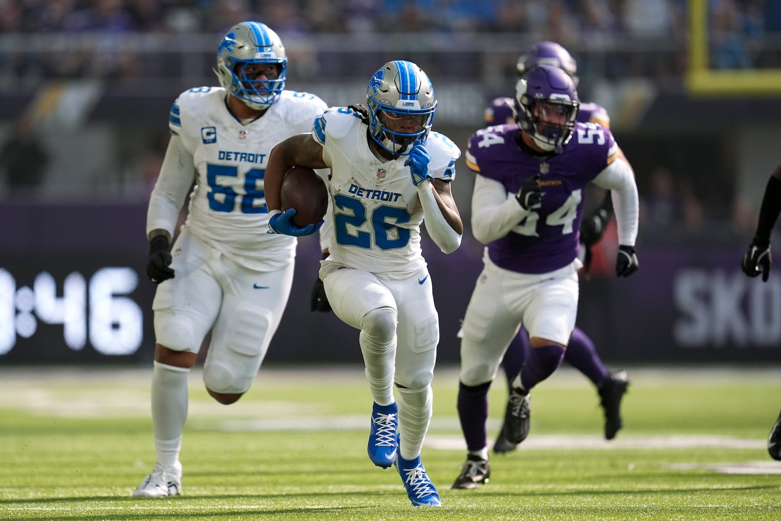 Detroit Lions running back Jahmyr Gibbs (26) runs for a 45-yard touchdown against the Minnesota Vikings during the first half of an NFL football game Sunday, Oct. 20, 2024, in Minneapolis. (AP Photo/Abbie Parr)