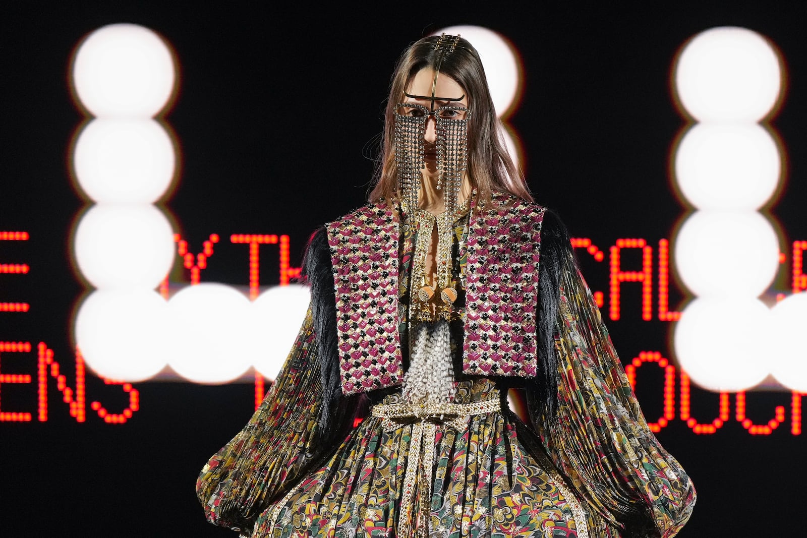 A model wears a creation as part of the Valentino Haute Couture Spring Summer 2025 collection, that was presented in Paris, Wednesday, Jan. 29, 2025. (AP Photo/Lewis Joly).