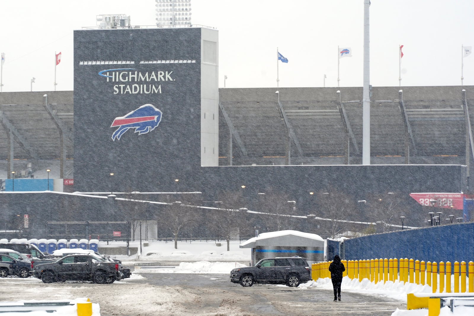 A stadium worker arrives at Highmark Stadium for a Sunday Night Football game between the Buffalo Bills and the San Francisco 49ers on Sunday, Dec. 1, 2024 in Orchard Park, N.Y. (AP Photo/Gene J. Puskar)