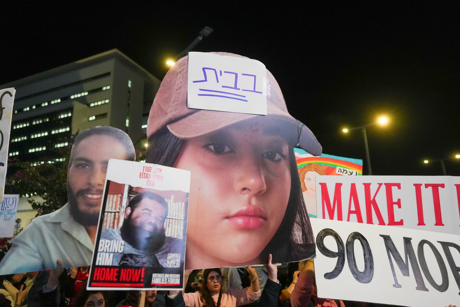 Demonstrators protest calling for the immediate release of the hostages held in the Gaza Strip by the Hamas militant group in Tel Aviv, Israel, Saturday, Jan. 25, 2025. (AP Photo/Ohad Zwigenberg)